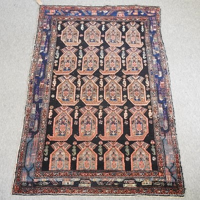 Lot 242 - An antique Persian rug