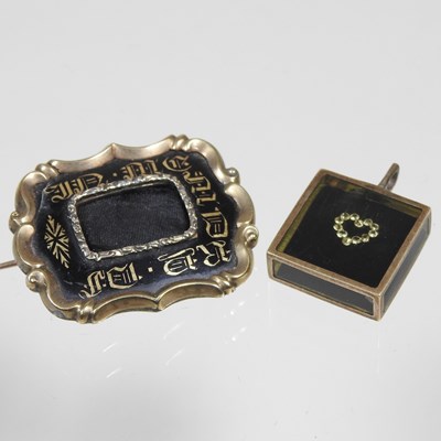 Lot 43 - A Victorian enamelled mourning brooch, with a...