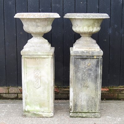 Lot 11 - A pair of large cast stone garden urns, each...