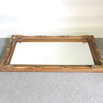 Lot 444 - A modern gilt framed wall mirror, with a swept...