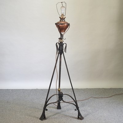 Lot 665 - An Arts and Crafts wrought iron and brass standard lamp