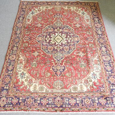 Lot 110 - A Persian Tabriz carpet, with a large central...