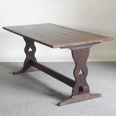 Lot 125 - A mid 20th century oak refectory dining table,...