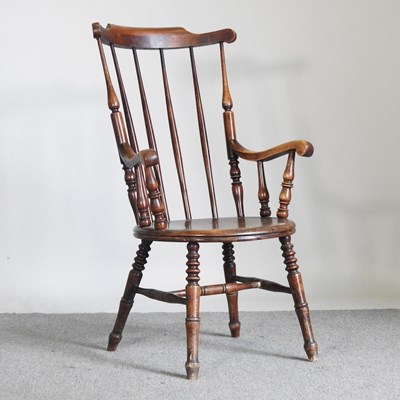 Lot 93 - A Victorian stick back armchair, on turned legs