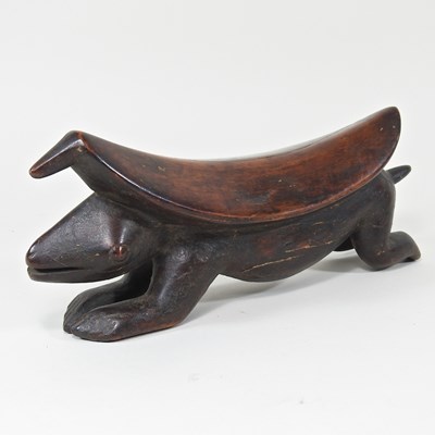 Lot 26 - An African carved wooden zoomorphic...