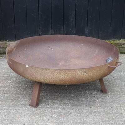 Lot 249 - A large rusted metal firepit, on stand, 101cm...