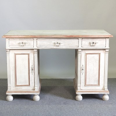 Lot 8 - A continental white painted pine pedestal desk,...