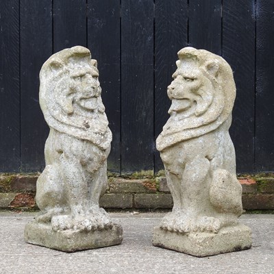 Lot 405 - A pair of cast stone garden statues of lions,...