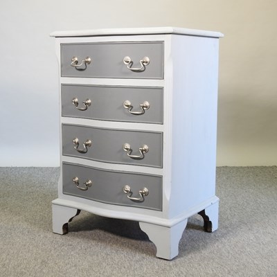 Lot 454 - A grey painted serpentine bedside chest