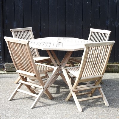 Lot 1 - A teak folding garden table, 99cm diameter,...