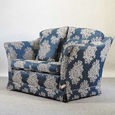 Lot 648 - A blue floral upholstered sofa