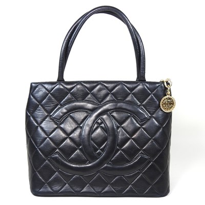 Lot 62 - A Chanel Medallion tote bag, in quilted black...