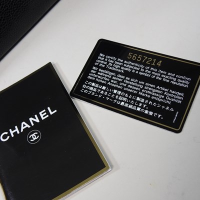 Lot 120 - A Chanel Kelly style handbag, in black caviar...