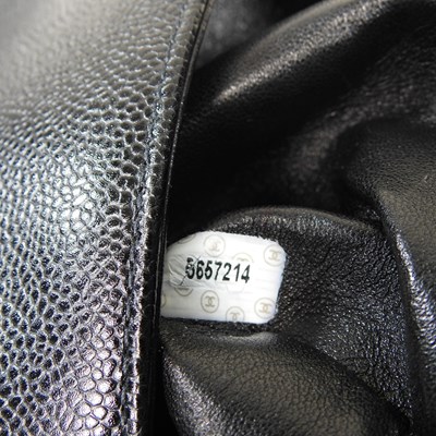 Lot 120 - A Chanel Kelly style handbag, in black caviar...