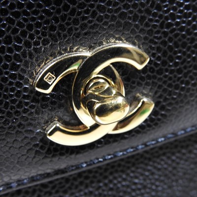 Lot 120 - A Chanel Kelly style handbag, in black caviar...