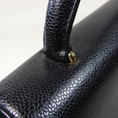 Lot 120 - A Chanel Kelly style handbag, in black caviar...