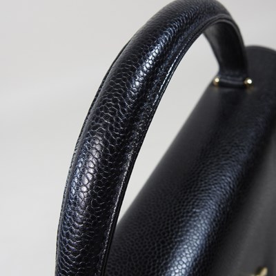 Lot 120 - A Chanel Kelly style handbag, in black caviar...