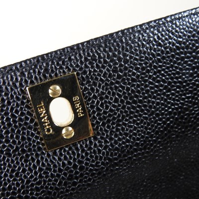 Lot 120 - A Chanel Kelly style handbag, in black caviar...