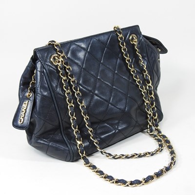 Lot 104 - A Chanel handbag, in navy quilted leather,...