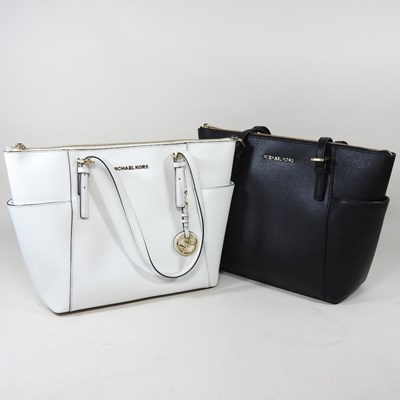 Lot 162 - A Michael Kors tote bag, in white leather,...