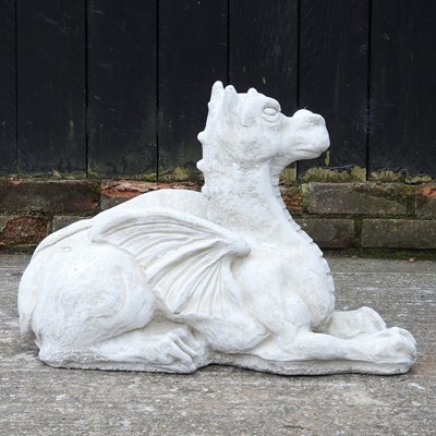 Lot 63 - A cast stone garden model of a dragon, 47cm high