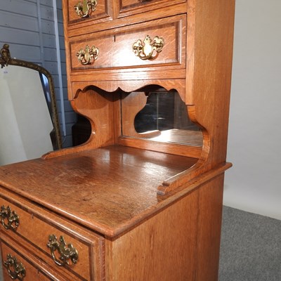 Lot 659 - An early 20th century light oak side cabinet