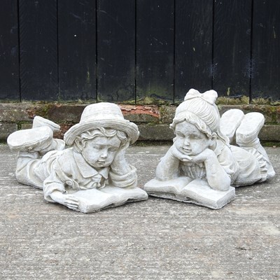 Lot 550 - A pair of cast stone garden statues of...