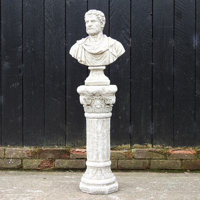 Lot 151 - A cast stone garden statue of a Roman bust, on...