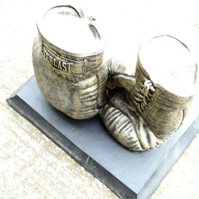 Lot 170 - A cast stone garden sculpture of boxing gloves,...