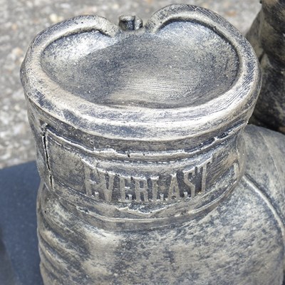 Lot 170 - A cast stone garden sculpture of boxing gloves,...
