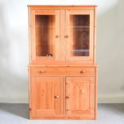 Lot 231 - A modern pine cabinet, with a glazed upper...