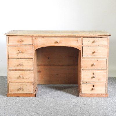 Lot 16 - An antique pine pedestal desk, on a plinth base