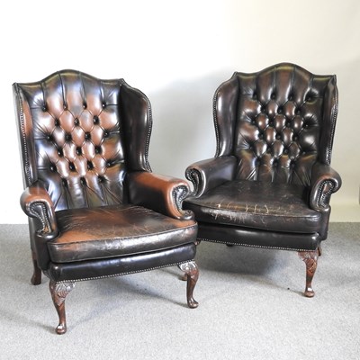 Lot 95 - A pair of brown leather upholstered button...