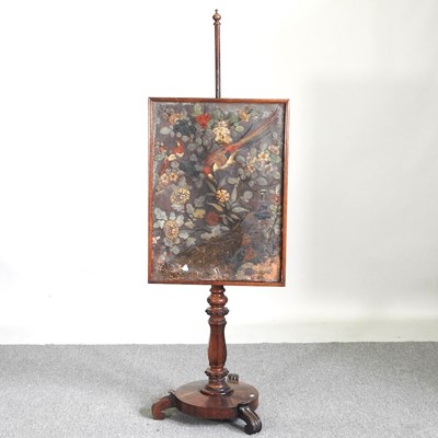 Lot 82 - A Victorian rosewood pole screen, with a...