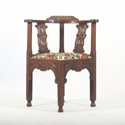 Lot 490 - A 19th century heavily carved dark oak corner chair