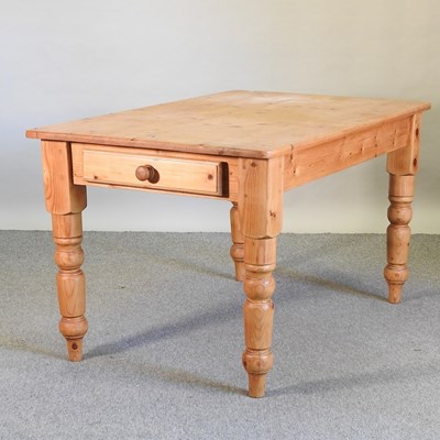 Lot 459 - A pine dining table