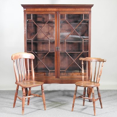 Lot 416 - A 1920's glazed bookcase, on cabriole legs,...