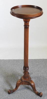 Lot 93 - A mahogany torchere, 110cm high, together with...