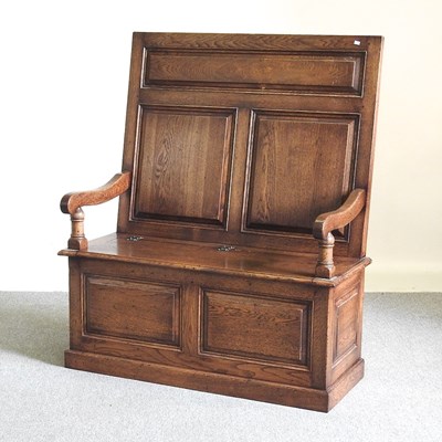 Lot 627 - An 18th century style oak box settle, 20th...