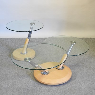 Lot 748 - A metamorphic glass top coffee table