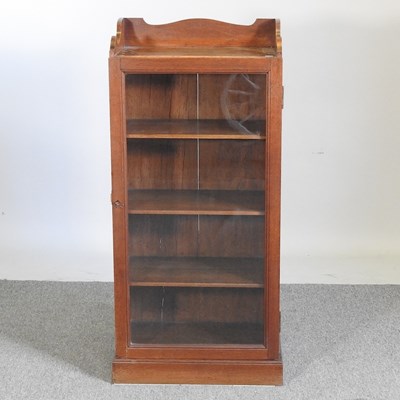 Lot 194 - An Edwardian mahogany music cabinet, with a...