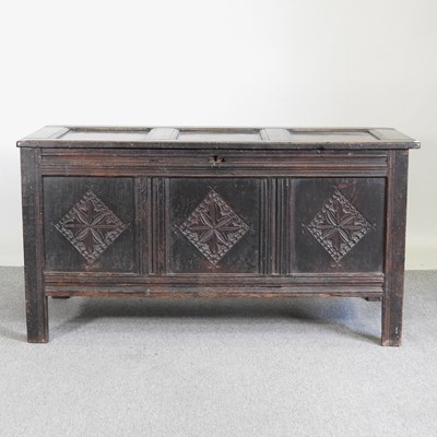 Lot 519 - An 18th century oak coffer, with a hinged lid...