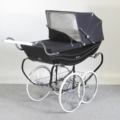 Lot 339 - A Silver Cross pram, in black canvas, with a...