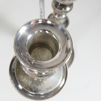 Lot 167 - A pair of silver plated four branch table...