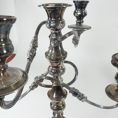 Lot 167 - A pair of silver plated four branch table...