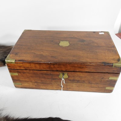 Lot 124 - A Victorian walnut and brass bound writing...