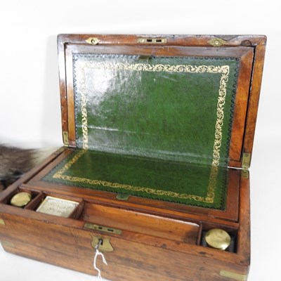 Lot 124 - A Victorian walnut and brass bound writing...
