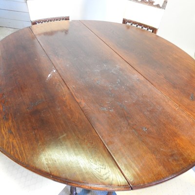 Lot 532 - An 18th century style oak gateleg dining table,...