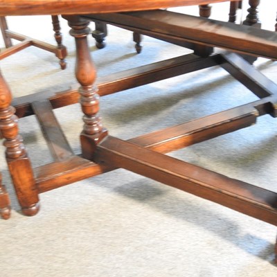 Lot 532 - An 18th century style oak gateleg dining table,...