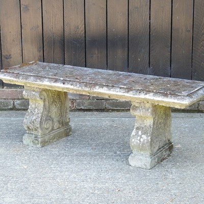 Lot 450 - A cast stone garden seat, on corbel supports